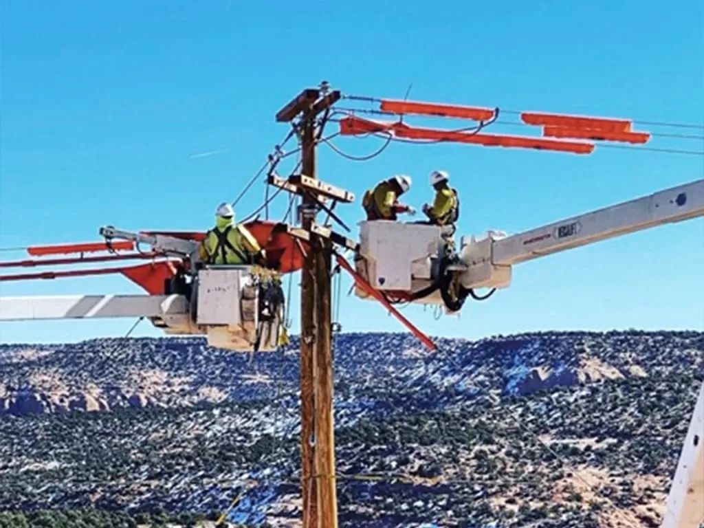 National Powerline crew working on a distribution line in Shiprock, NM