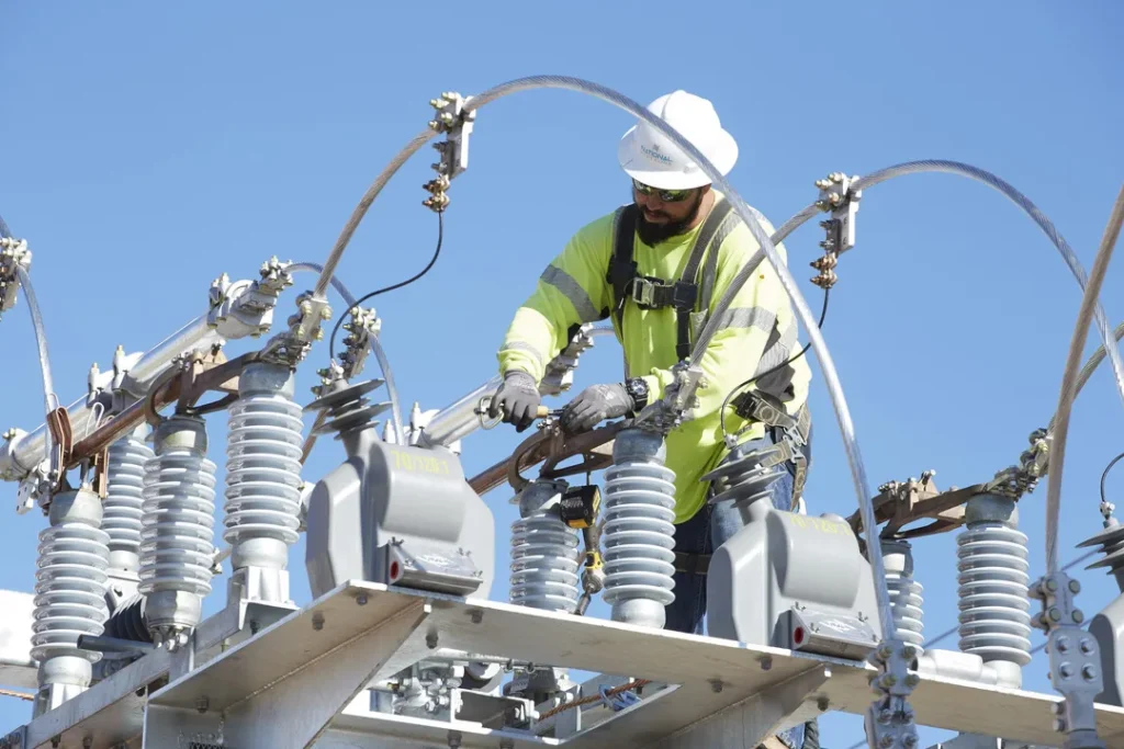 construction worker fixing power lines
