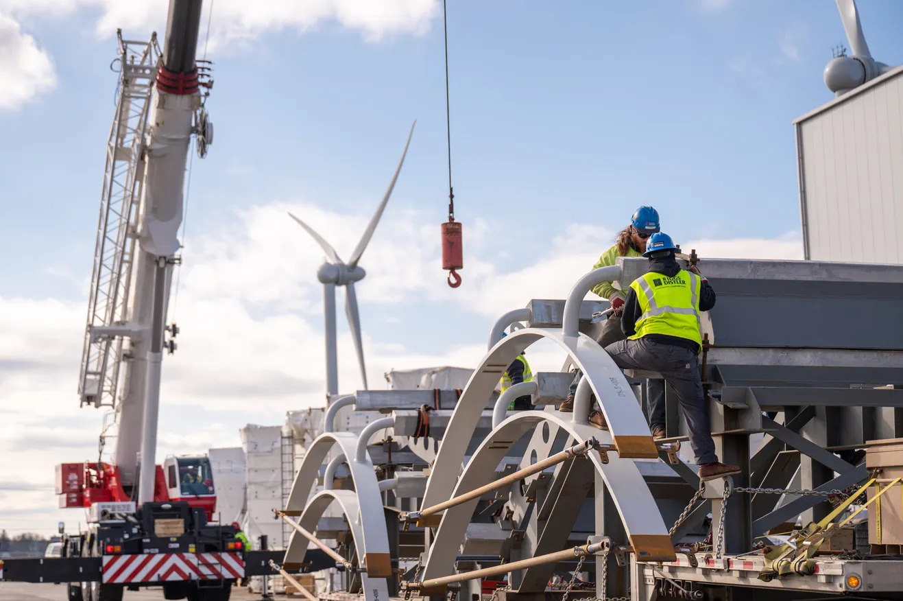 Construction working taking Portions Of Anode Cages Being Offloaded For Assembly