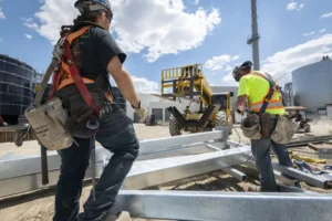 two construction workers moving resources